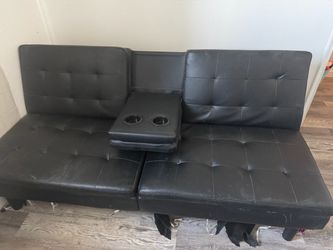 Black futon with cupholders