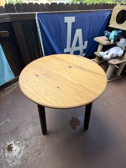 Round Wood Dining Table with Black Legs