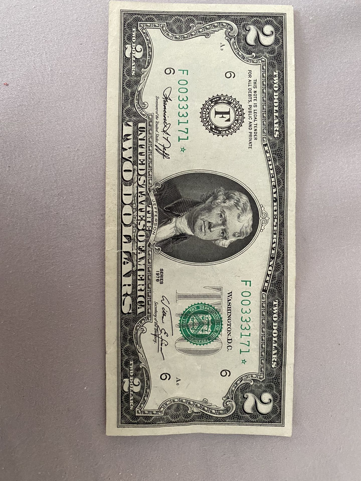 2 Dolares