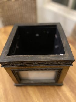 Decorative photo box. Has slots for four photos and storage