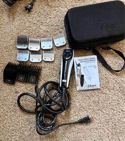 Oyster hair clipper with metal guards