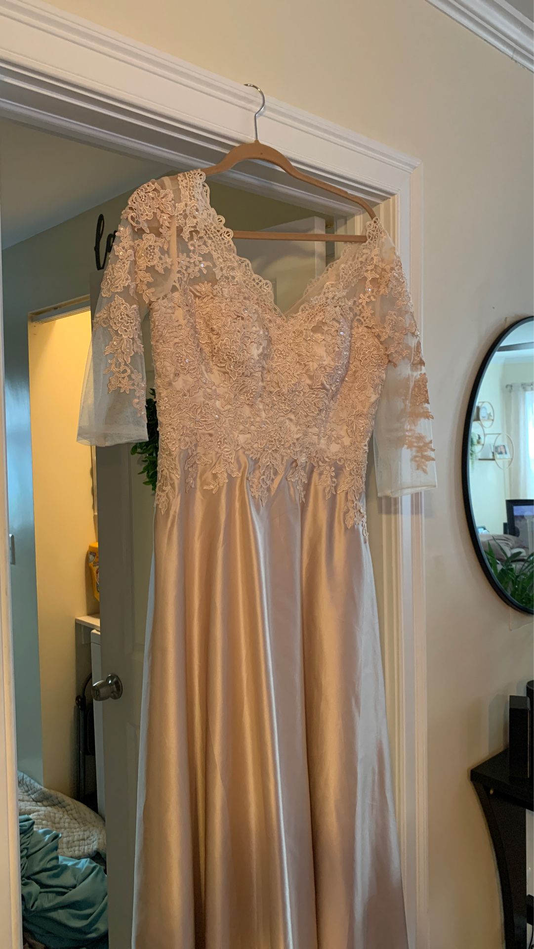 Never worn wedding/formal dress. Champagne color Size 12.