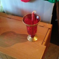 RED AND GOLD CANDLE HOLDER.