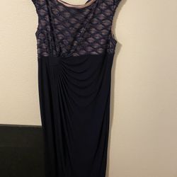 Dark Navy Blue Formal Gown with a beaded illusion top and draped skirt. Size 16. 