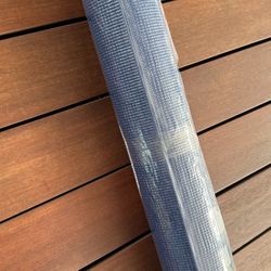 Brand new, wrapped blue yoga mat.