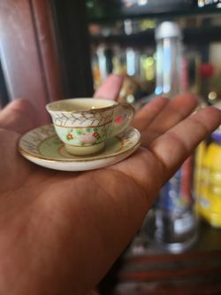 vintage miniature porcelain tea cup and saucer set