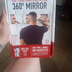 A Mirror That You See Different Ways To The Side Of Your Face To The Front To The Back