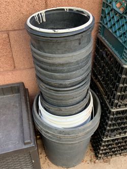 White and black Plastic containers buckets planters