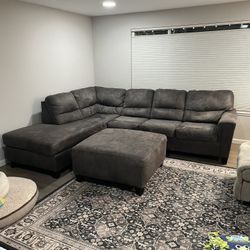 Ashley Furniture 2-piece Sectional with Chaise. Matching Ottoman included. 