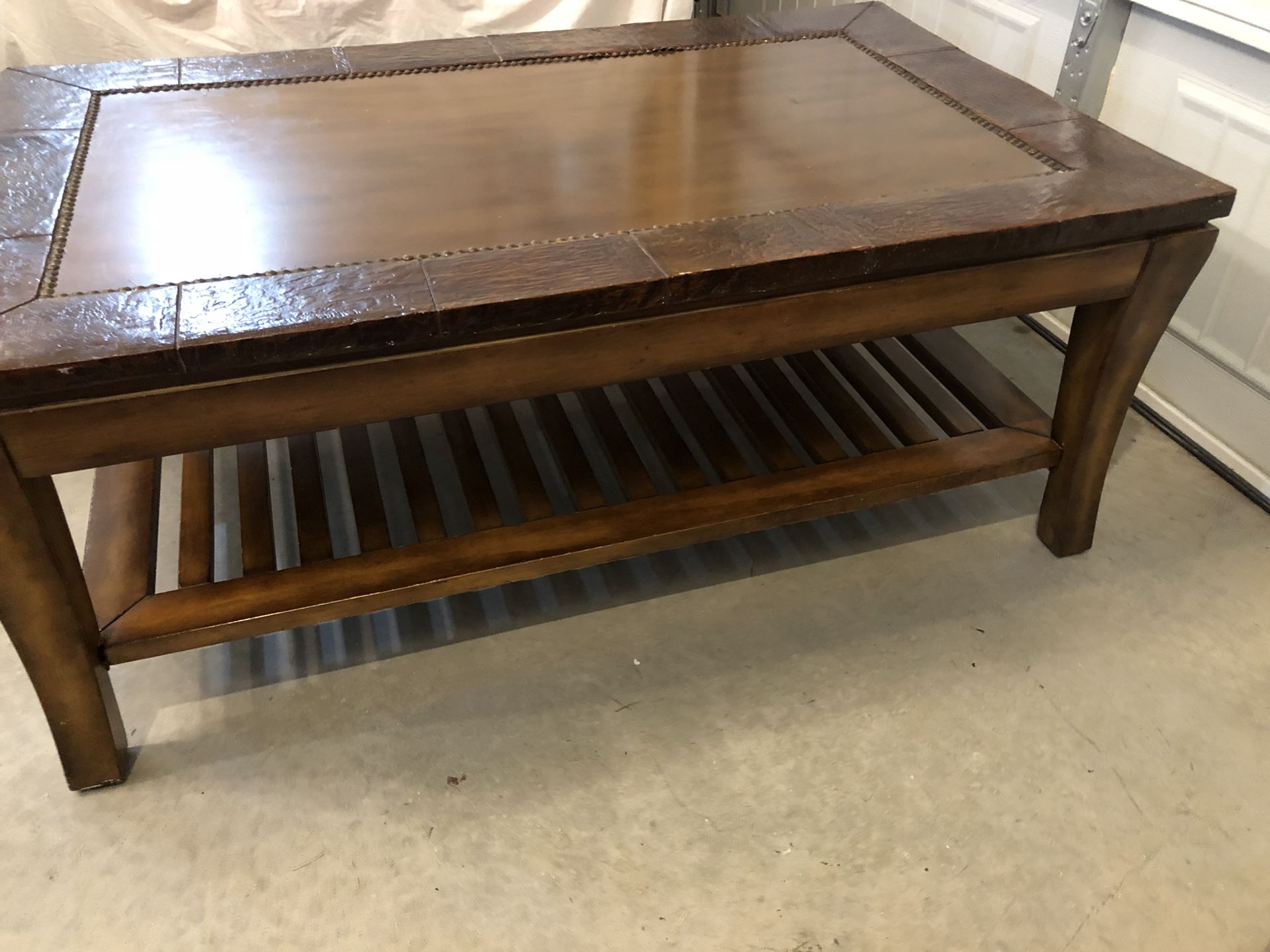 Large Copper-Toned Coffee Table with Brown Border Accents