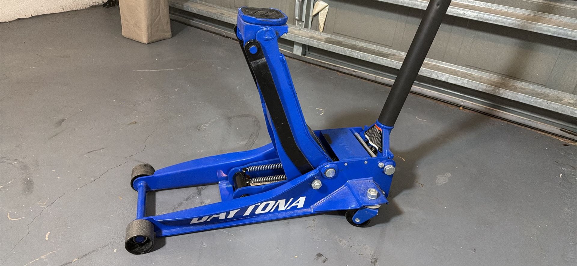 DAYTONA 3 Ton Long-Reach Low-Profile Professional Floor Jack with RAPID PUMP, Blue and lug wrench