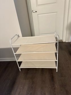 Fabric shoes rack with metal frame.