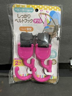 Brand new pink stroller clips… Hooks two in the package
