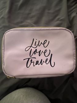 cosmetic or travel bag featuring the phrase "Live Love Travel