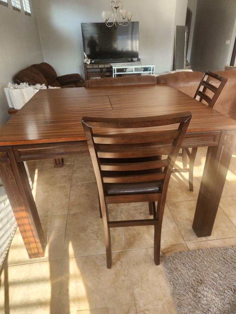 Dining table with four chairs used like new