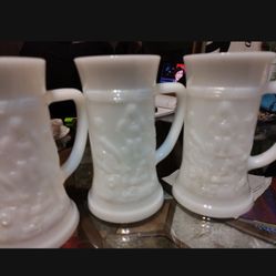 Six vintage milk, glass Steins, and one decanter
