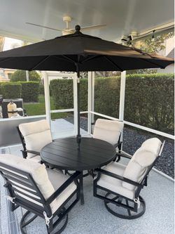 Outdoor Table and 4 Swivel Chairs