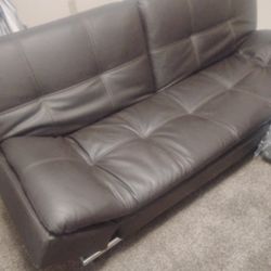 Dark Brown Leather Futon With Charging Ports Has A Little Wrinkle In Center But not Ripped It's From Another Couch Being In Top Of It