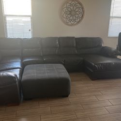  Brown Leather Sectional. Good Condition.ottoman Is Cloth. 