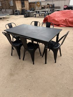 Black IKEA Dining Table paired with 6 Metal Chairs