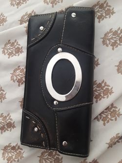 Black wallet and a small makeup bag