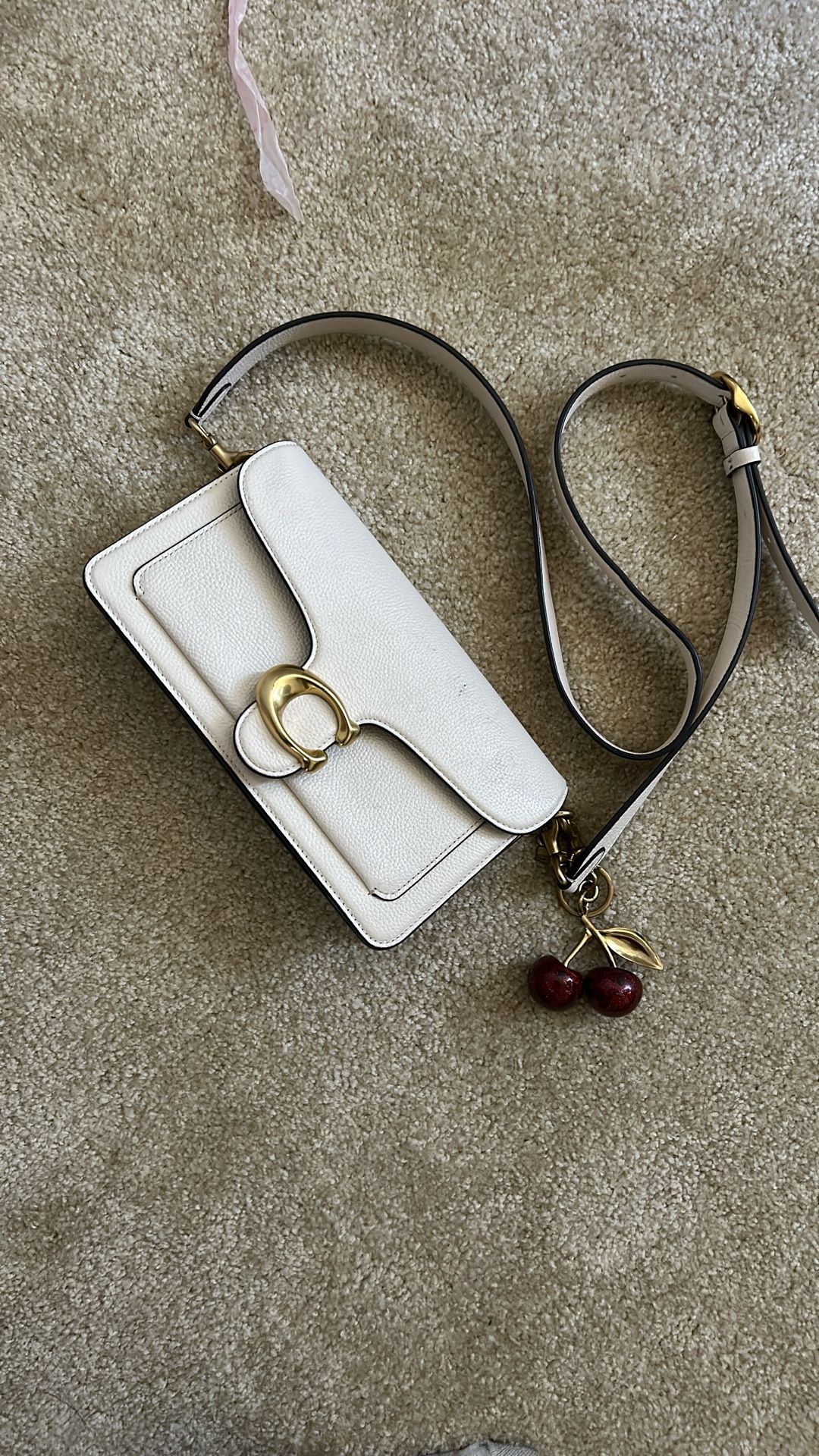 coach purse with cherry charm