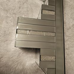 Mirrored metallic floating wall shelf