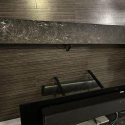 Extra long black wall shelving unit