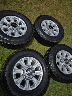 Ford f250 wheels 8 lugs tires like neww alll terrain
