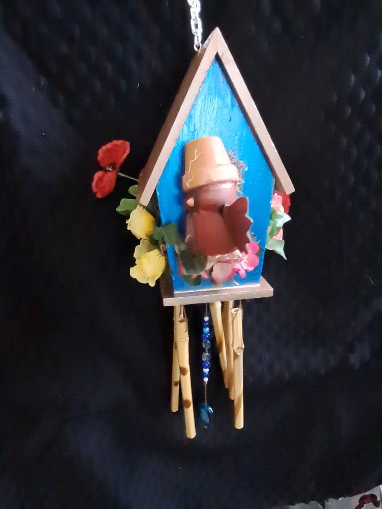 Silly Red Cardinal In a Blue Windchime House