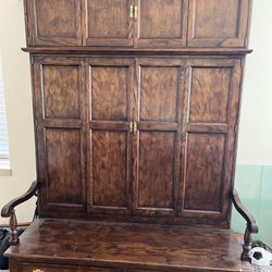 Armoire with shelf storage and seating