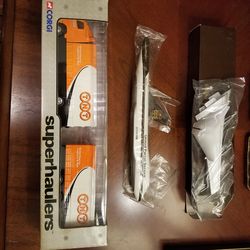 UPS Model 747 airplane, and TNT model Tractor and trailer. Brand new in boxes. Make offer