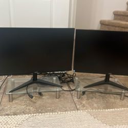 2 24inch Monitors AOC And 2 Monitor Glass  Stand Risers 