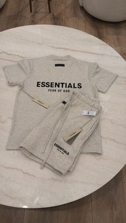 Essentials fear of god set shorts and shirt.