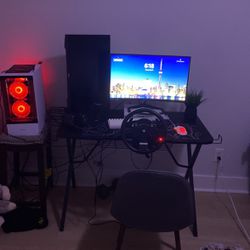 full gaming setup with gaming wheel and pedals