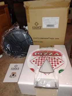 The Cook's Companion Pizza Oven is a countertop appliance designed to bake 12-inch pizza! Brand New!