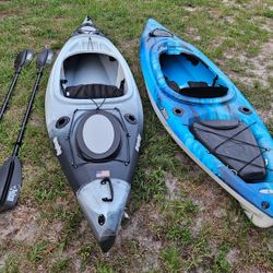 2 Sit In Kayaks With Paddles