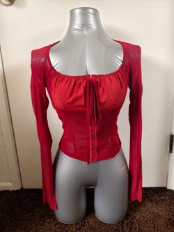 Stunning scarlet red long-sleeve mesh top with corset-inspired details.