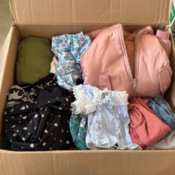 Box filled with girl clothes 3/4 