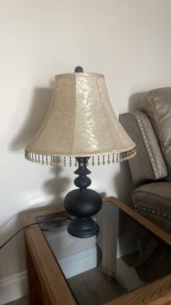 Vintage lampshade and black lamp with light bulb working Vintage lampshade and black more modern lamp with light bulb working