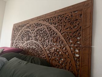 Carved wood headboard