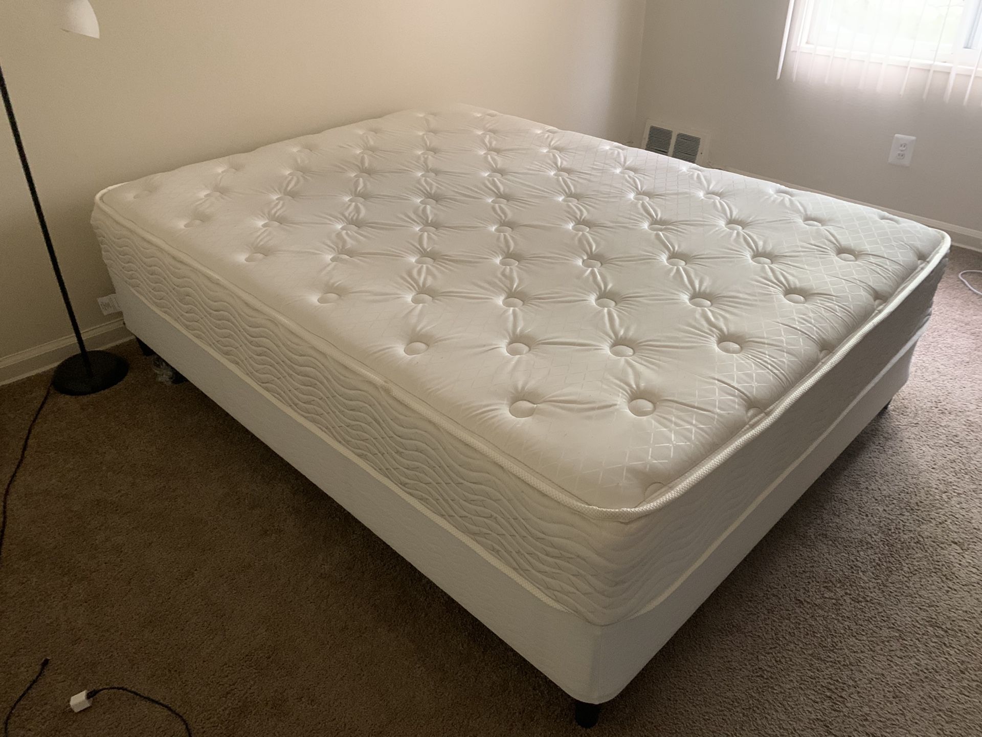 Queen size mattress and a box spring. In excellent condition