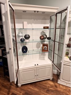 Wooden and glass cabinet with lighting