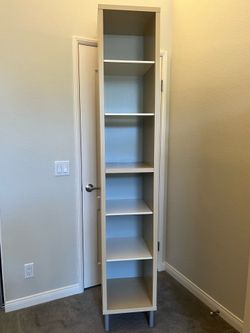 IKEA TALL BEIGE BOOKSHELF RAISED FEET-6 SHELVES-82” TALL, 15” LEFT TO RIGHT, 15” FRONT TO BACK