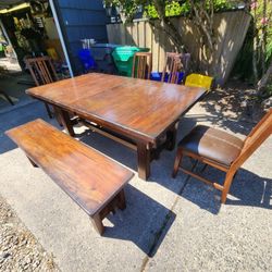 Kitchen Table with leaf, bench, 4 dining chairs with leather seats. Dark brown weathered look 