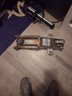 Two car jacks and a grinder