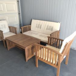 Outdoor patio wood couch with chairs and coffee table 