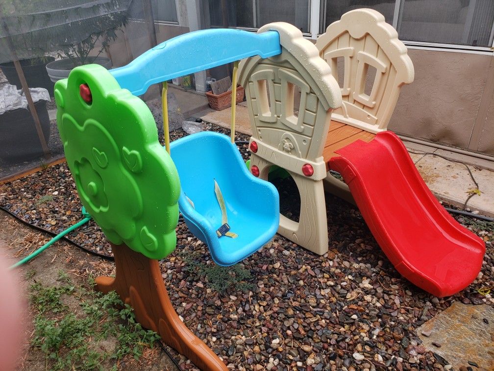 Toddler play set with slide and swing.