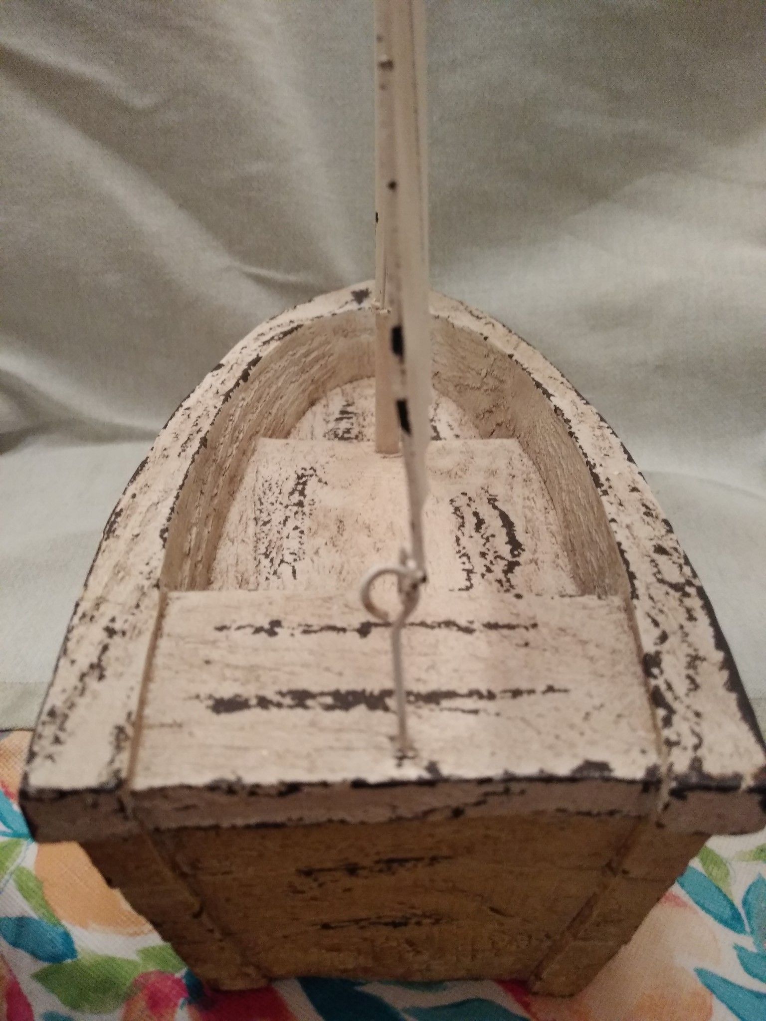 Sailboat featuring a metal rustic-looking sail