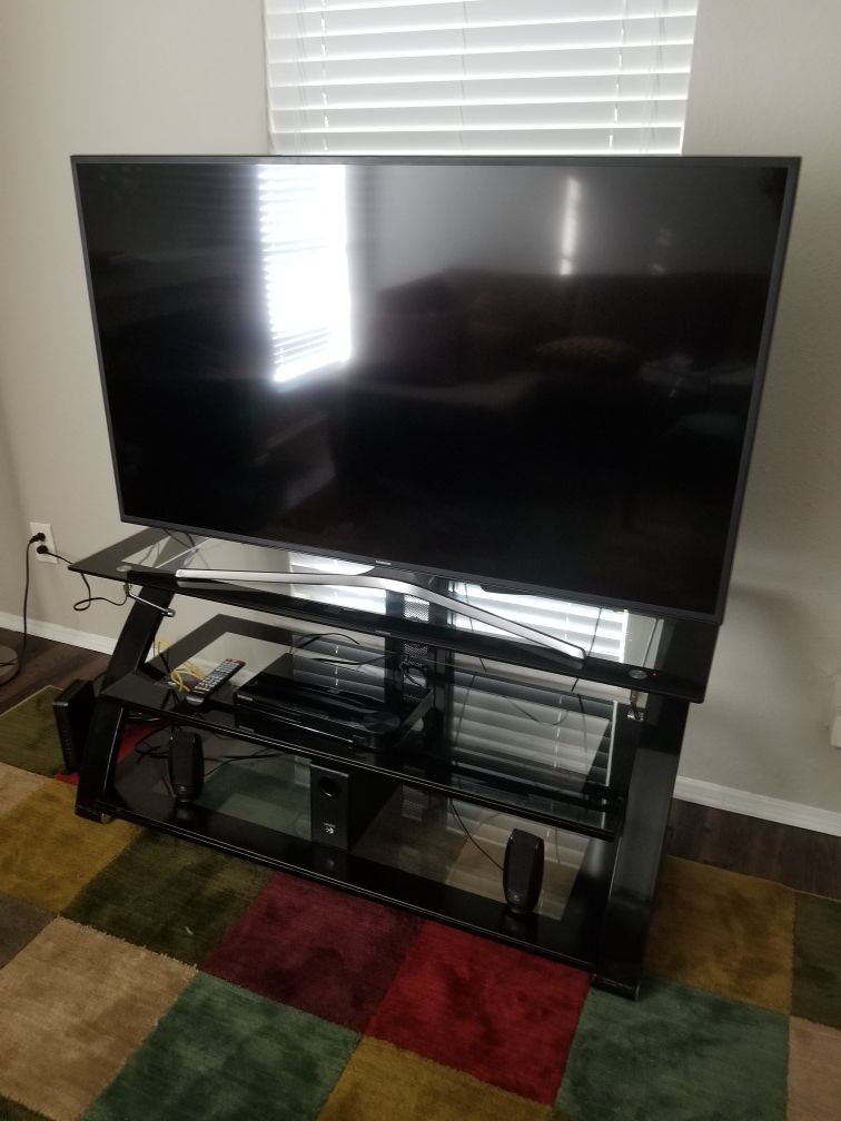 55 inches Samsung TV and the TV stand both for seal...